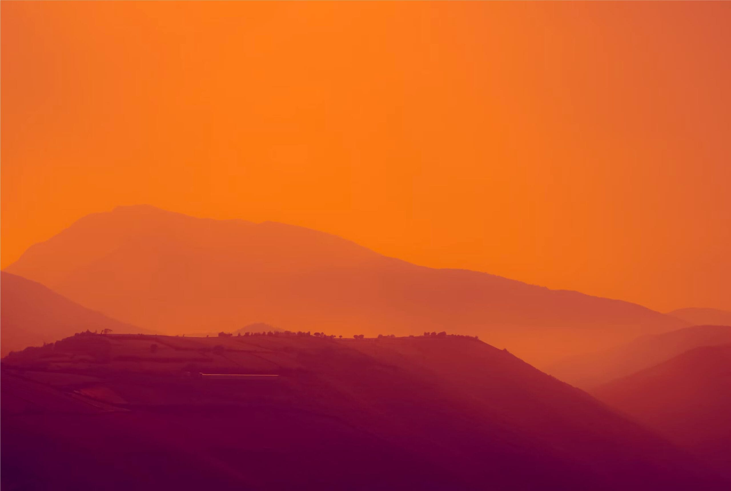 mountains with orange sky