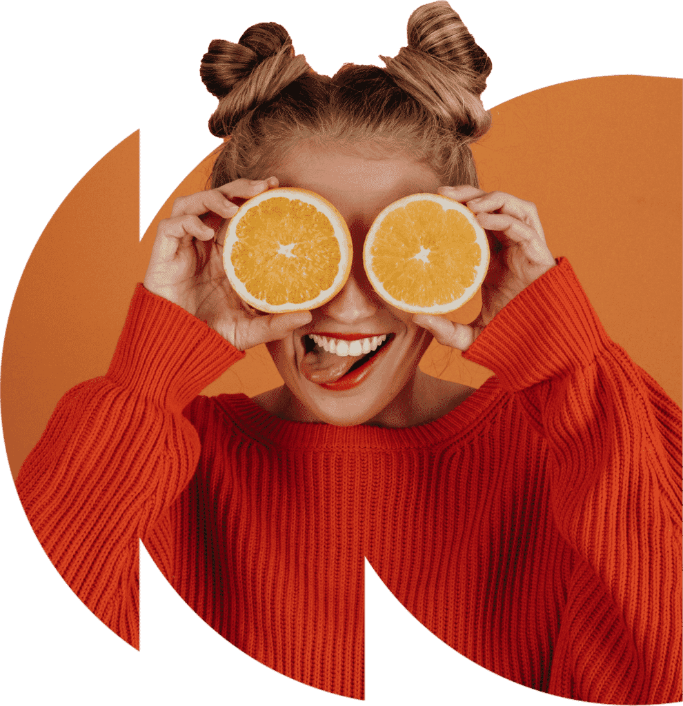 person smiling with oranges over their eyes