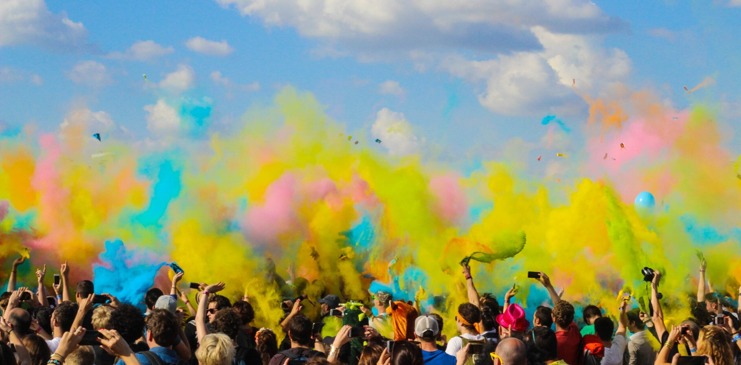 crowd with colourful smoke