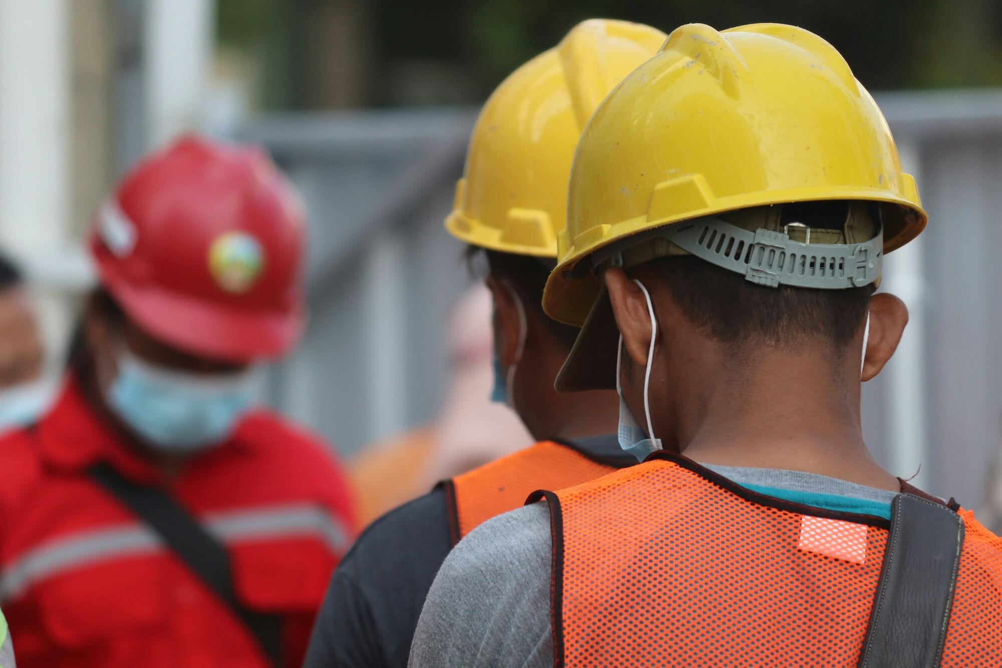 people with hardhats on