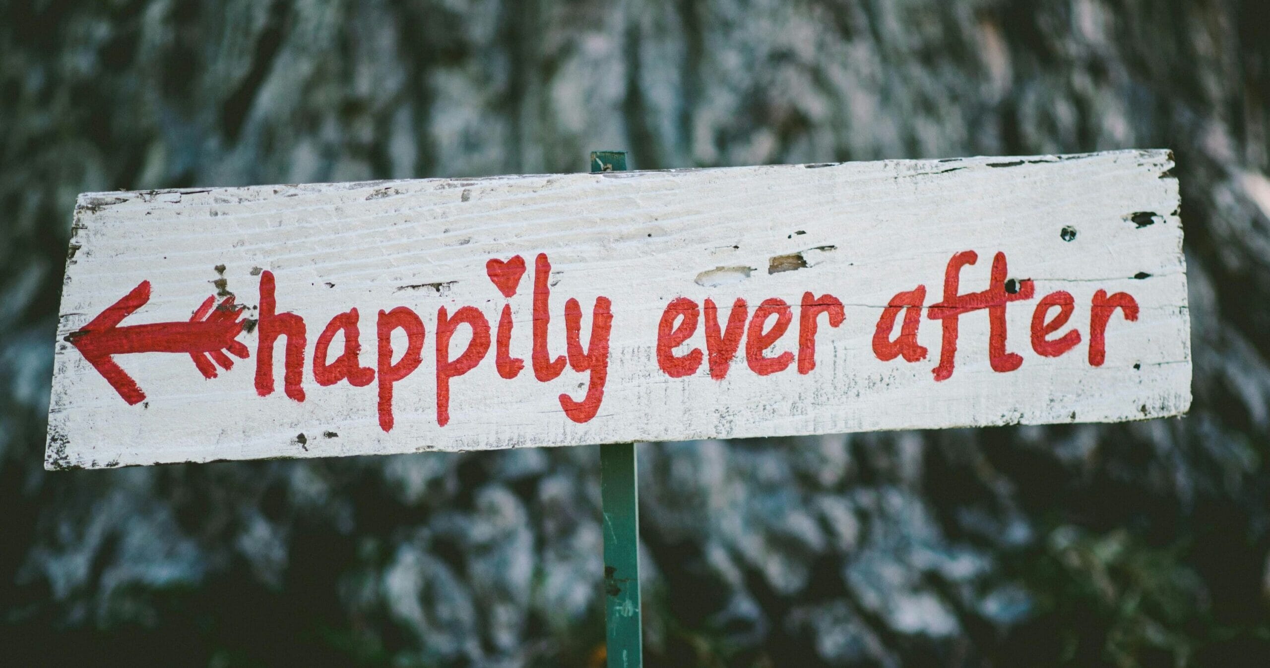 sign that reads happily ever after