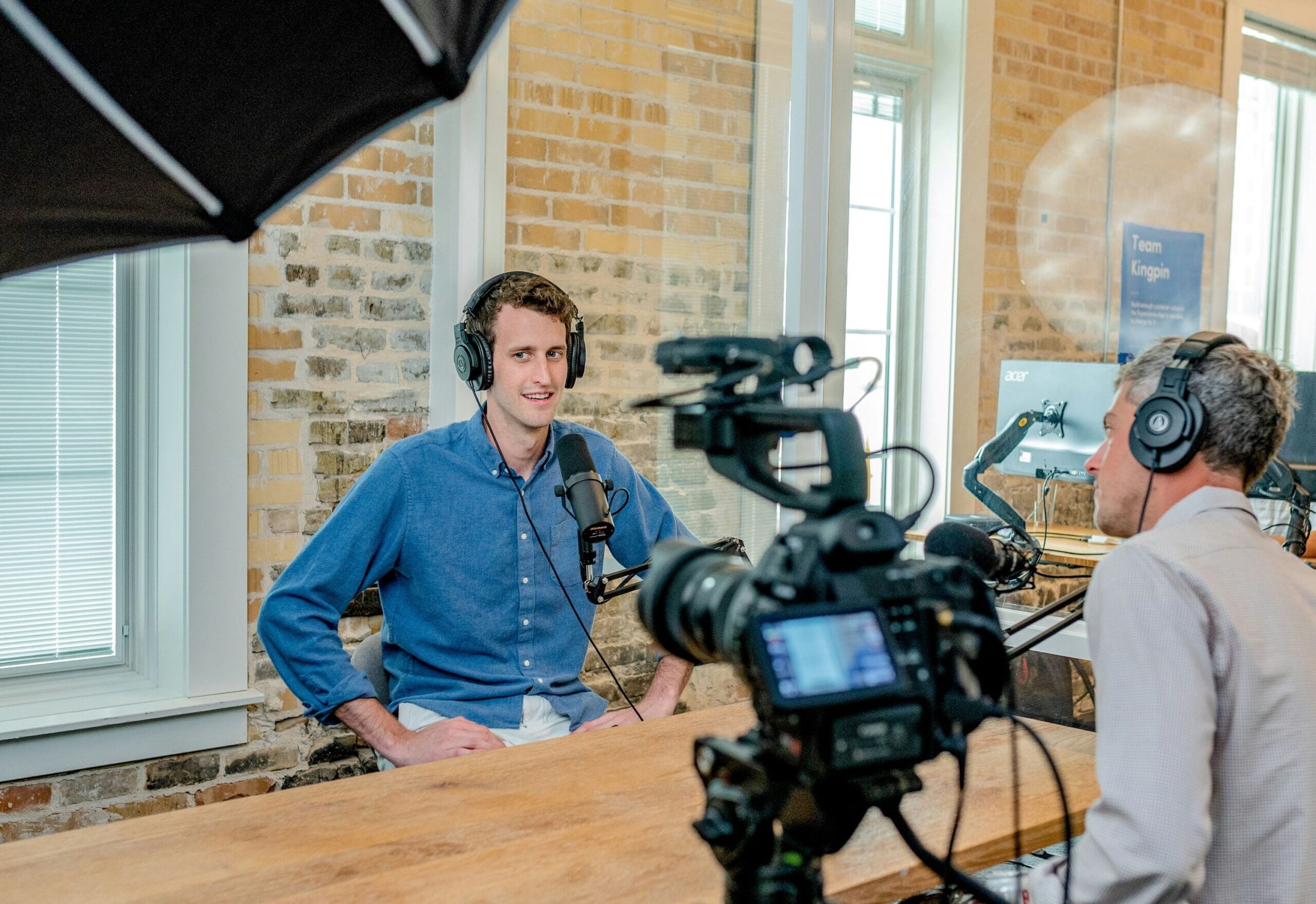 man filming an interview