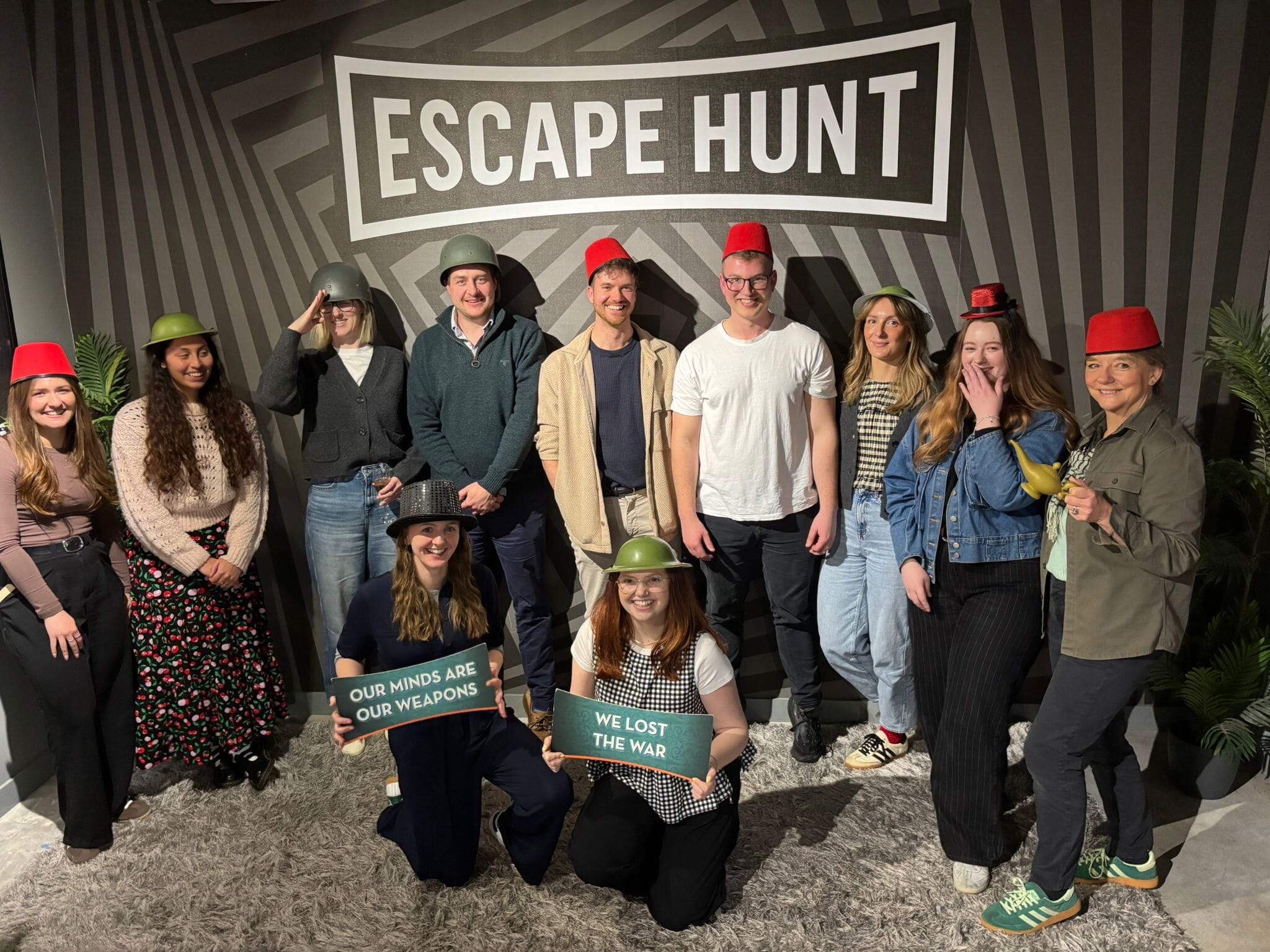 energy pr team at an escape room with props