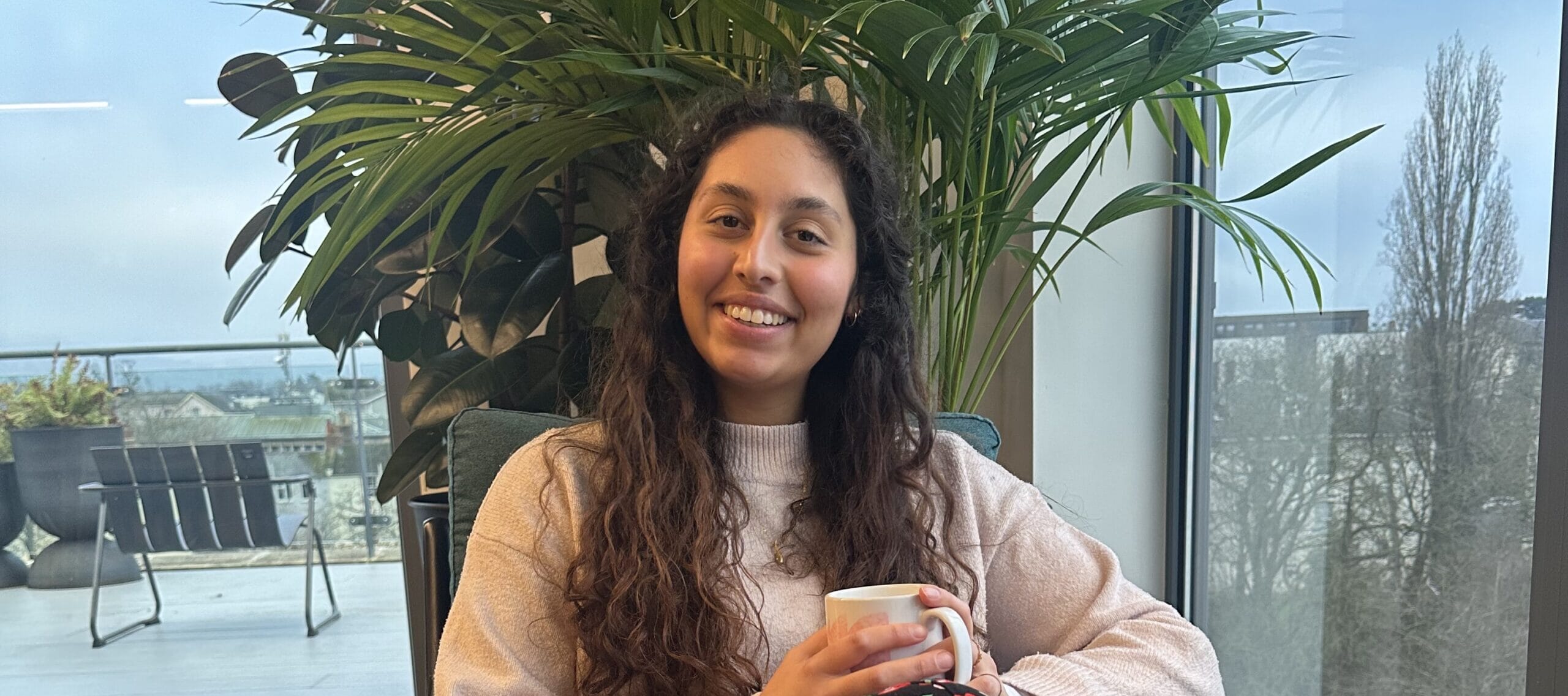 sasha cook sat down with a mug in her hands